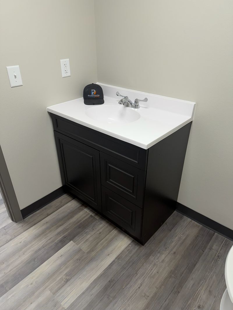 New bathroom vanity and sink installed by Paragon Plumbing