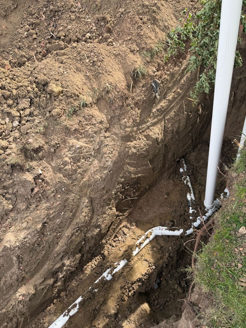 New sewer line with cleanout riser in an excavated trench
