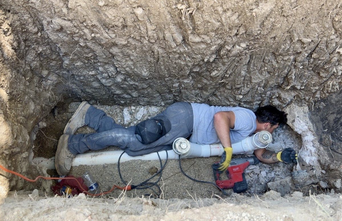 Paragon Plumbing technician repairing an underground line